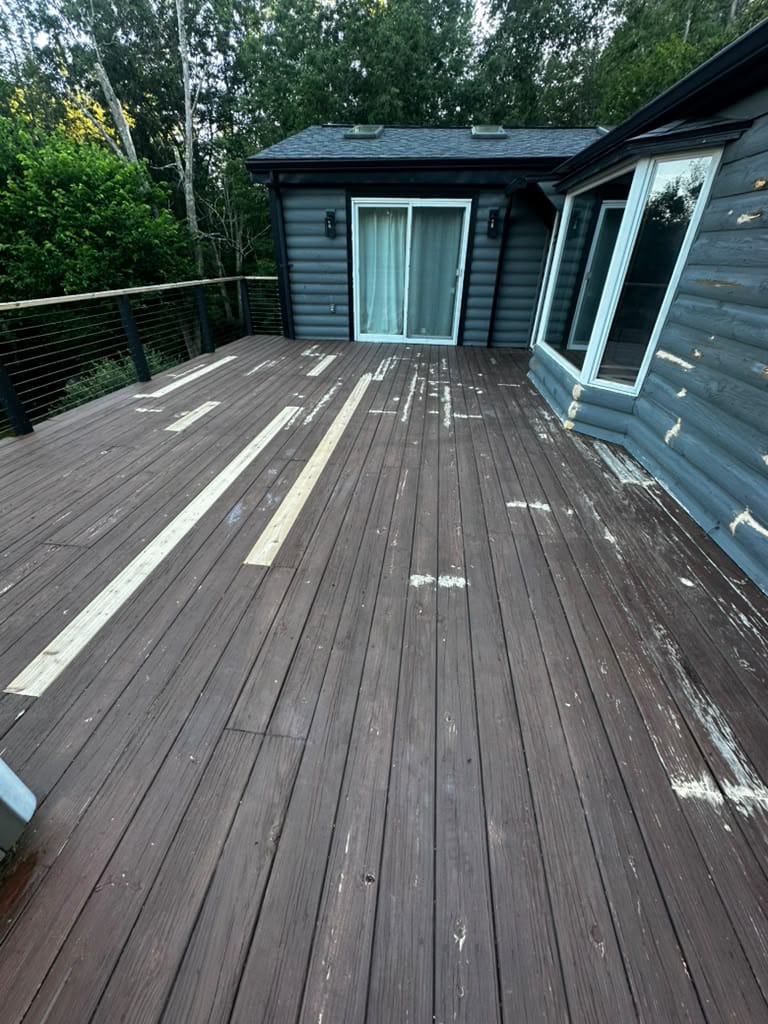 Before deck painting Rhode Island project showing a weathered outdoor deck